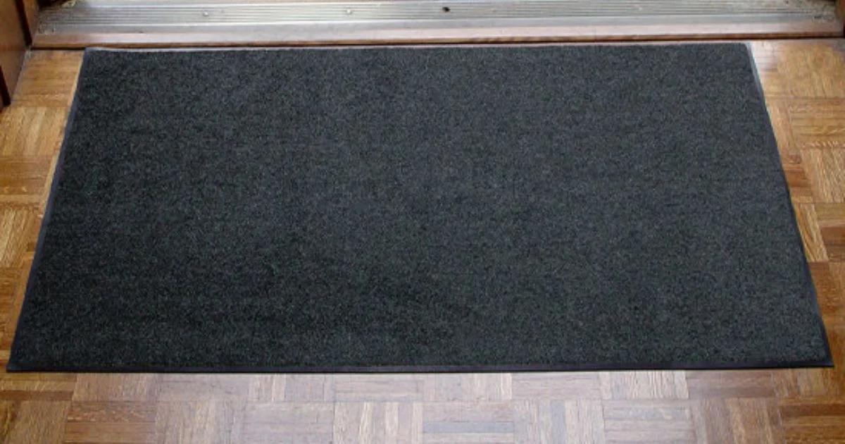 Commercial entrance floor mat on hardwood floor